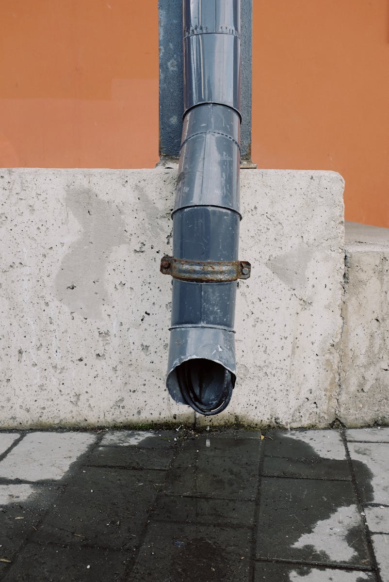 House Drain Pipe on Concrete Wall